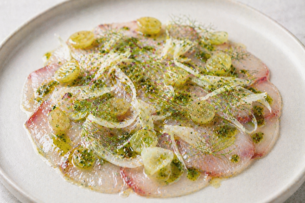 HIRAMASA CARPACCIO WITH GRAPES, FENNEL AND DILL OIL